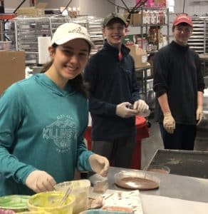 volunteer students donating chocolate