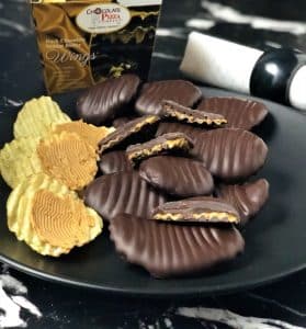 dark peanut butter wings on plate with potato chips