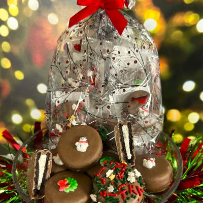 decorated holiday cookies in cello bag with bow